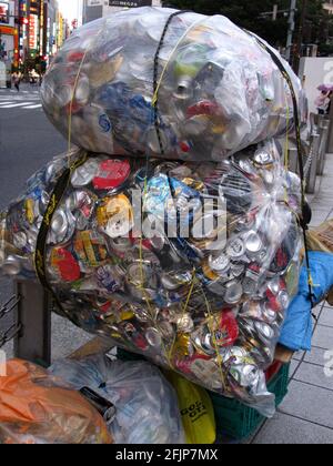 Garbage bags with beverage cans, can collection, recycling, Tokyo, Japan Stock Photo