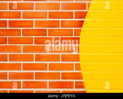 Brick wall background with yellow painted. Empty space on vivid color brick wall texture. Stock Photo
