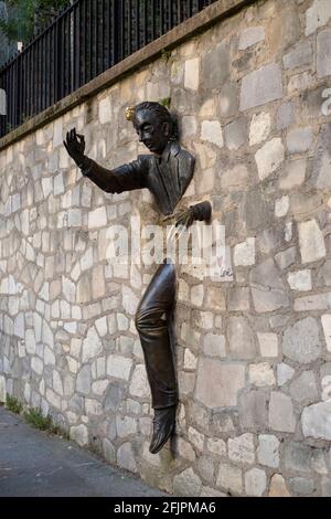 Paris, France - July 05, 2018: Sculpture Walking Through Walls in Montmartre in Paris Stock Photo