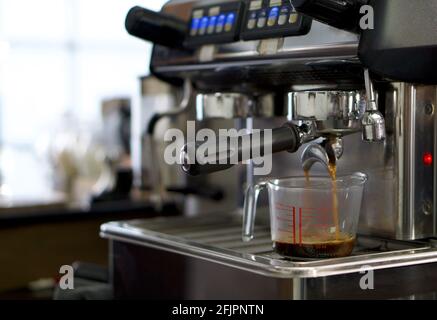 Espresso machine, hot water dispenser and coffee grinder in a bar Stock  Photo - Alamy