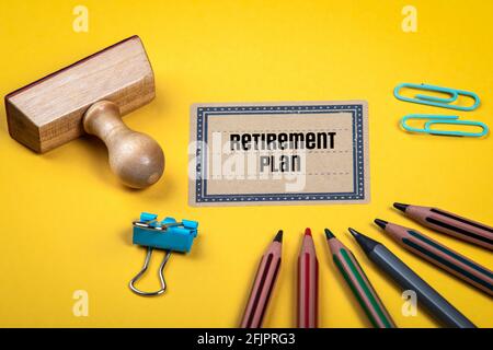 Retirement Plan. Yellow document folder and office supplies. Stock Photo