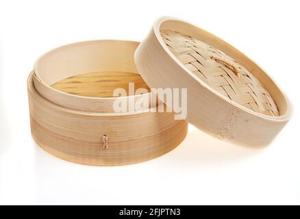 Dimsum container chinese japanese food bamboo steamer with clipping path isolated on white background Stock Photo
