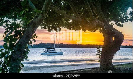 evening mood at Pumicestone Passage against the backdrop of the Glass House Mountains, seen from Bongaree, Briebie Island, Moreton Bay region, Queensl Stock Photo