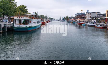 Rostock, Mecklenburg-Western Pomerania, Germany - June 12, 2020: View at the Old Stream in Warnemuende with restaurants and bars Stock Photo