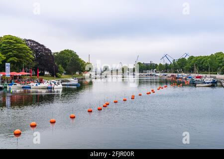 Rostock, Mecklenburg-Western Pomerania, Germany - June 12, 2020: View at the Old Stream in Warnemuende with the Rostock harbour in the background Stock Photo