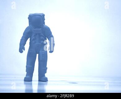 Model printed on 3d printer close-up. Cosmonaut of blue color. Stock Photo