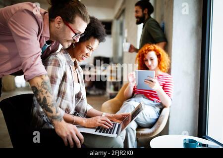 Creative managers crew working with new startup project in office. Team brainstorming. Stock Photo