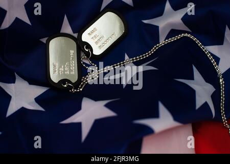 Soldier's token on American flag background Stock Photo