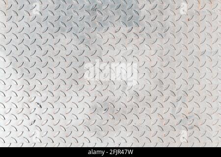Non slip metal sheet plate surface texture as industrial background, checkered diamond embossed pattern, top view Stock Photo