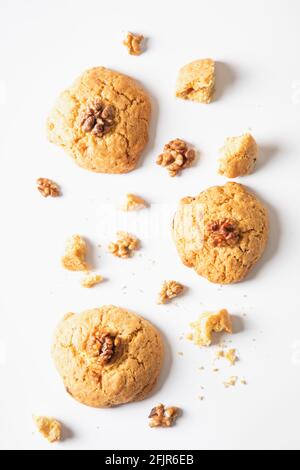 homemade cookies chocolate chips with nuts on a white background, top view. Stock Photo