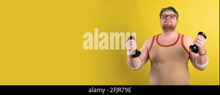 gym promotion poster. an overweight man doing sports on a yellow background. Funny fat man Stock Photo
