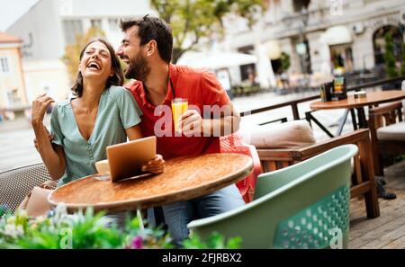 Beautiful couple in love having fun on a date in a cafe Stock Photo
