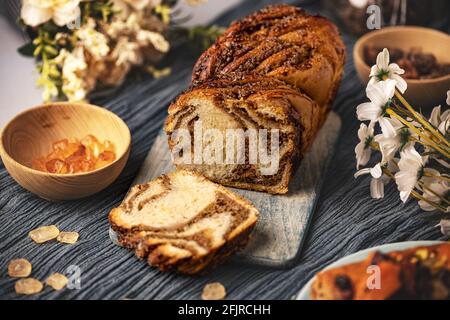 Freshly baked sourdough sweet swirl bread walnut babka, twisted loaf bread Stock Photo