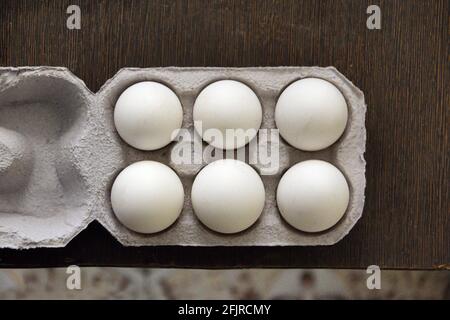 Six eggs in egg box Stock Photo