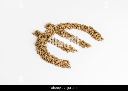 Perspective view on euro sign made from golden pieces on white background Stock Photo
