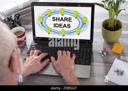 Share ideas concept shown on a laptop used by a man Stock Photo