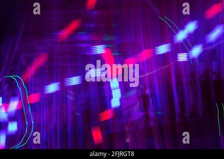 Long exposure photo of colorful moving lights creating beautiful abstract patterns. Stock Photo