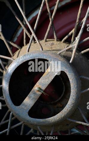 rusting vintage car spoked wheel Stock Photo