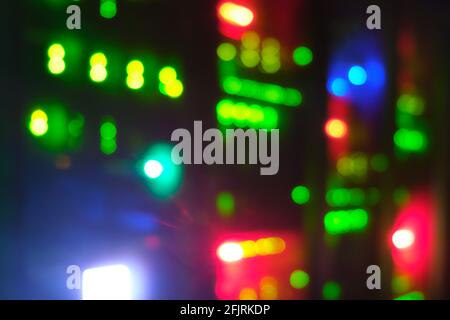 Blurred background of servers of it companies and mobile operators, bokeh of lights of computers and network routers Stock Photo