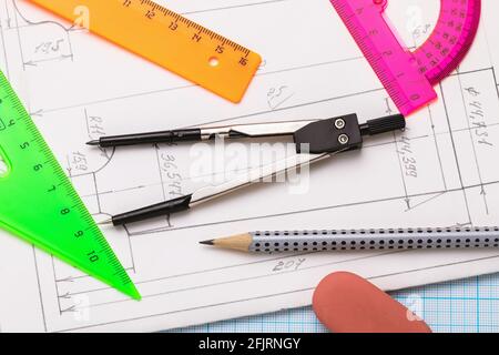 Various tools for sketching on paper with blueprints, top view. Stock Photo
