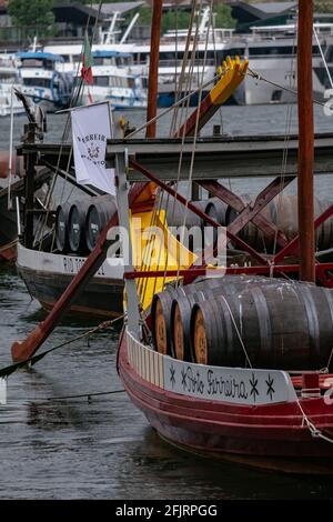 Traditional and Iconic Rabelo Boats moored in Douro River - Cloudy Sky with Rain - Porto, Portugal Stock Photo