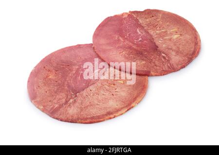 Studio shot of sliced ox tongue cut out against a white background - John Gollop Stock Photo