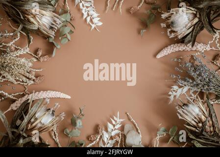 Composition with dry wildflowers, spikelets and protea flowers flat lay. Stock Photo