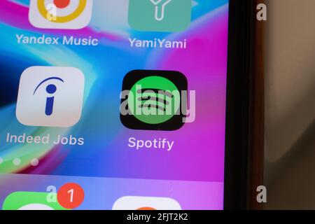 New York, USA - 26 April 2021: Spotify app logo on phone screen close-up top view, Illustrative Editorial Stock Photo