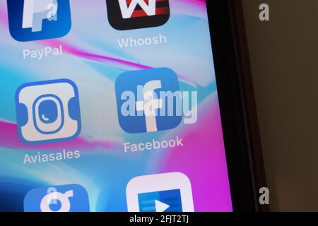 New York, USA - 26 April 2021: Facebook app logo on phone screen close-up top view, Illustrative Editorial Stock Photo