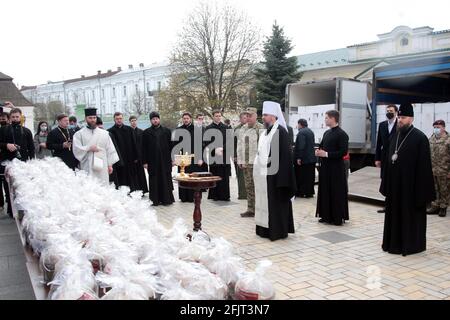 KYIV UKRAINE - APRIL 26, 2021 - Primate of the Orthodox Church of Ukraine, Metropolitan of Kyiv and Ukraine Epifanii blesses paskas (Ukrainian Easter bread loaves) in the St Michael's Golden-Domed Monastery that will be sent to Ukrainian soldiers involved in the Joint Forces Operation in the east of the country ahead of Easter (May 2), Kyiv, capital of Ukraine. Credit: Ukrinform/Alamy Live News Stock Photo