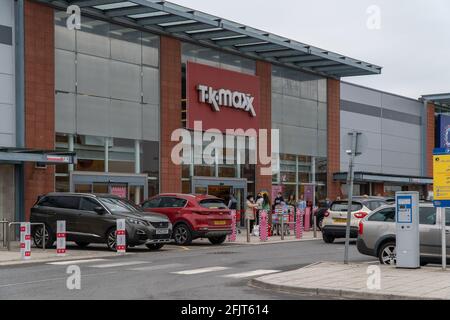 Dundee, Tayside, Scotland, 26.04.21: Large queues wait to enter TK Maxx at the Gallagher Retail Park in Dundee, as Scotland leaves its second lockdown and restrictions are relaxed, and the shops open up again. Credit: Barry Nixon Stable Air Media/Alamy Live News Stock Photo