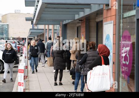 Dundee, Tayside, Scotland, 26.04.21: Large queues wait to enter TK Maxx at the Gallagher Retail Park in Dundee, as Scotland leaves its second lockdown and restrictions are relaxed, and the shops open up again. Credit: Barry Nixon Stable Air Media/Alamy Live News Stock Photo