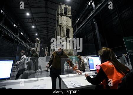Milan, Italy. 26th April, 2021. People at the mass vaccination hub coordinated by ASST Nord Milano opens at “Pirelli HangarBicocca” where the monumental site-specific art installation ‘The Seven Heavenly Palaces 2004-2015' by artist Anselm Kiefer is on display. Credit: Piero Cruciatti/Alamy Live News Stock Photo