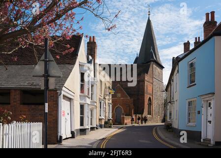 Silver Street, view in Spring of Silver Street in the Essex market town of Maldon, showing the the tower and west wall of All Saints Church, England Stock Photo