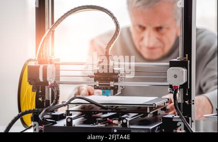 Man with 3D printer Stock Photo