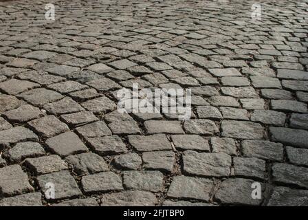 Stone paving roadway surface closeup as stone background Stock Photo