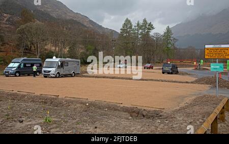 Glenfinnan, Lochaber, UK. 26th April 2021. Jacobite Steam Train first trip of 2021 did not encourage very many  visitors to the newly built car park that leads to the new 'Glenfinnan Wee Harry Potter Bridge' which has been crowdfunded by the  community who raised £8,467 to allow them to build a bridge to cross the River Finnan to keep the normal 350,000 tourists  that arrive each year safe and off of the busy road that runs between Fort William and Mallaig. Stock Photo