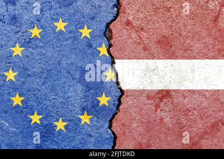 Flags of EU and Latvia painted on cracked wall background - Politics conflicts concept Stock Photo