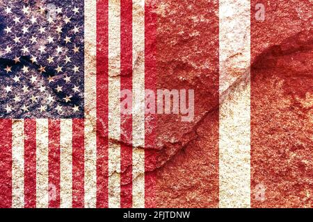 Flags of USA and Latvia painted on cracked wall background - Politics alliance concept Stock Photo