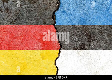 Flags of Germany and Estonia painted on cracked wall background - Politics conflicts concept Stock Photo