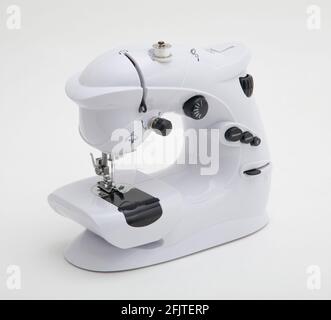 Small sewing machine isolated on white background Stock Photo