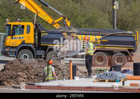 JOHN REILLY (CIVIL ENGINEERING) LIMITED of CHORLEY; Stages of construction; Farington Mews Beat the Stamp Duty Deadline - Keepmoat homes & John Reilly Civil Engineering Ltd development site in Chorley. Builders Start construction on this large new housing estate development site pouring wet concrete flooring. UK Stock Photo