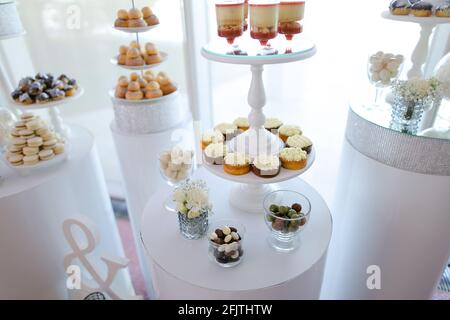 Yummy sweets and desserts on candy bar. Stock Photo