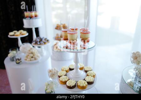Tasty sweets and desserts on candy bar. Stock Photo