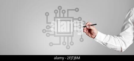 Businessman draws a computer processor chip on gray background. Future technology AI concept Stock Photo
