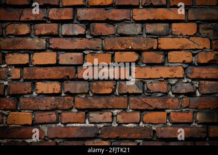 Brick wall red old weathered texture background. Grunge old house aged dark bricks. Stock Photo