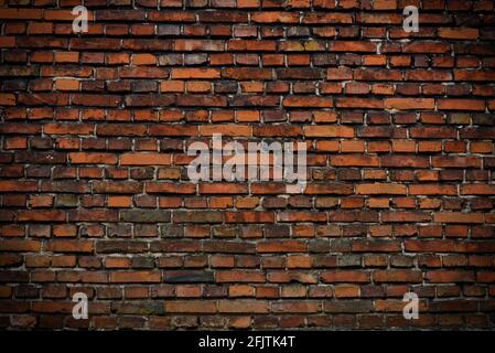 Brick wall red old weathered texture background. Grunge old house aged dark bricks. Stock Photo
