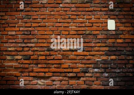 Brick wall red old weathered texture background. Grunge old house aged dark bricks. Stock Photo