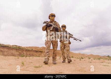 Two special forces rangers during the military operation in the desert Stock Photo