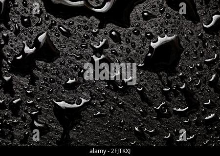 Water drops on black slate tray, background, pattern Stock Photo